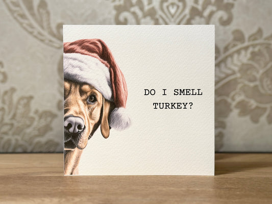 Card with a dog wearing a Santa hat and text 'Do I smell turkey?'