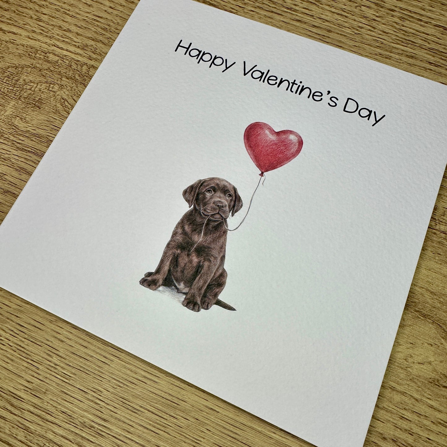 Chocolate Labrador with Heart Balloon